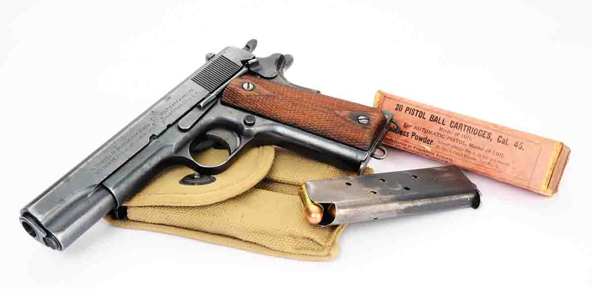 A Colt Model 1911 of 1918 vintage with a box of .45 Auto dated 1915. Velocity is rated at 800 fps.